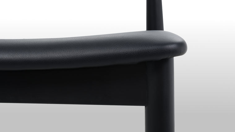 PERFECTLY PRACTICAL | Courtesy of its minimalist silhouette and smart design, the Elbow Chair is lightweight and stackable. Change up your dining and office space effortlessly with this chic seat.
