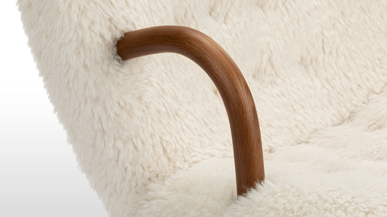 Friendly Form | Small in stature but big in terms of personality, the Clam chair is a seat that calls to you from across the room. The gentle curves of the backrest, bentwood arms, and rounded legs give this chair a friendly and inviting appearance that promises to wrap you up in hygge.
