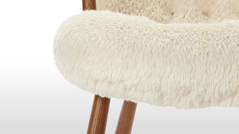 Nordic Details | Playfully named because of its resemblance to a shell, the Clam chair’s simple, playful form pays homage to Scandinavian design in its honest, understated use of European hardwood and plush long-hair upholstery.
